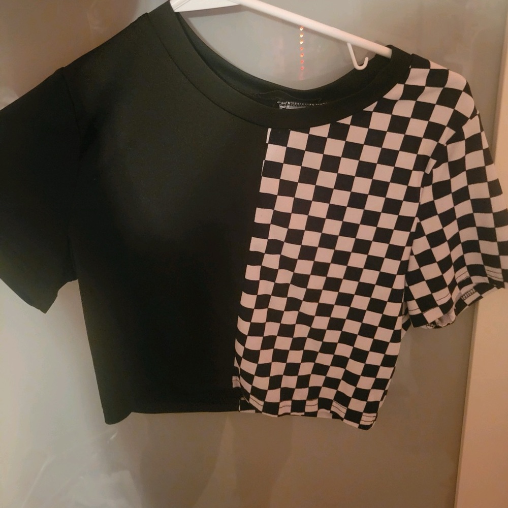 Short mini t shirt. Two prints. Haven’t touched in 2 years. Soft to the touch